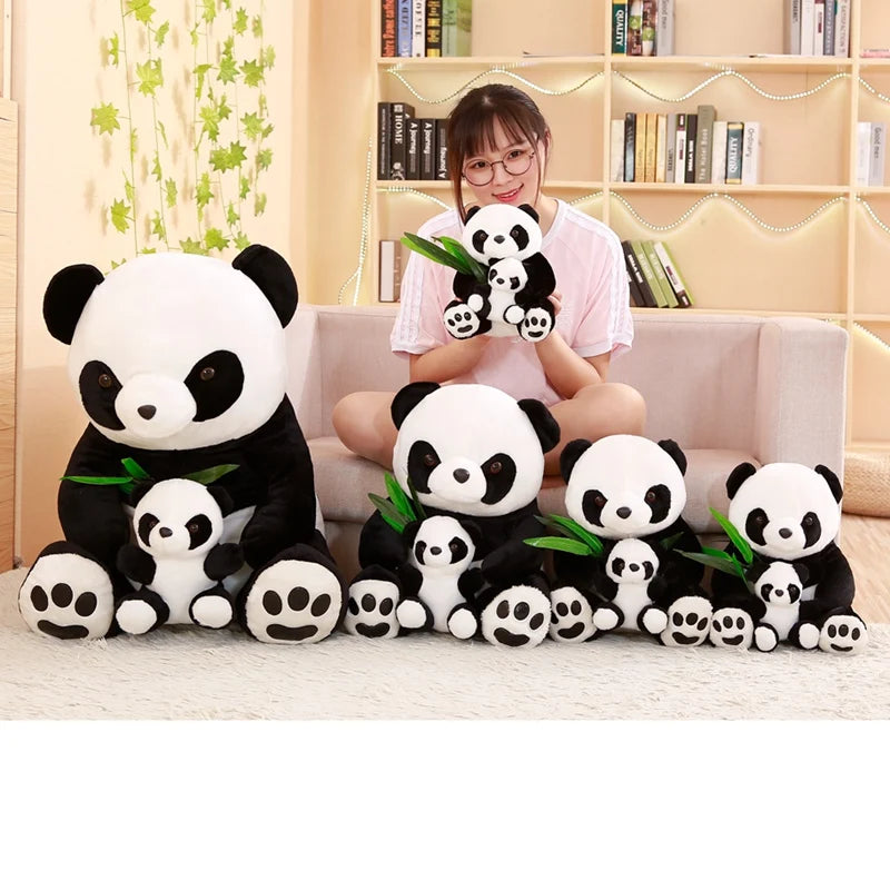 Person holding a large panda plush toy with smaller panda plush toys on a couch.