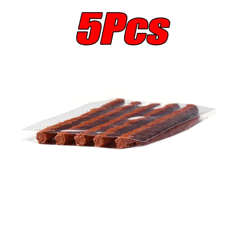 Five brown tire plugs for tire repair in clear packaging with '5PCS' text above on a white background