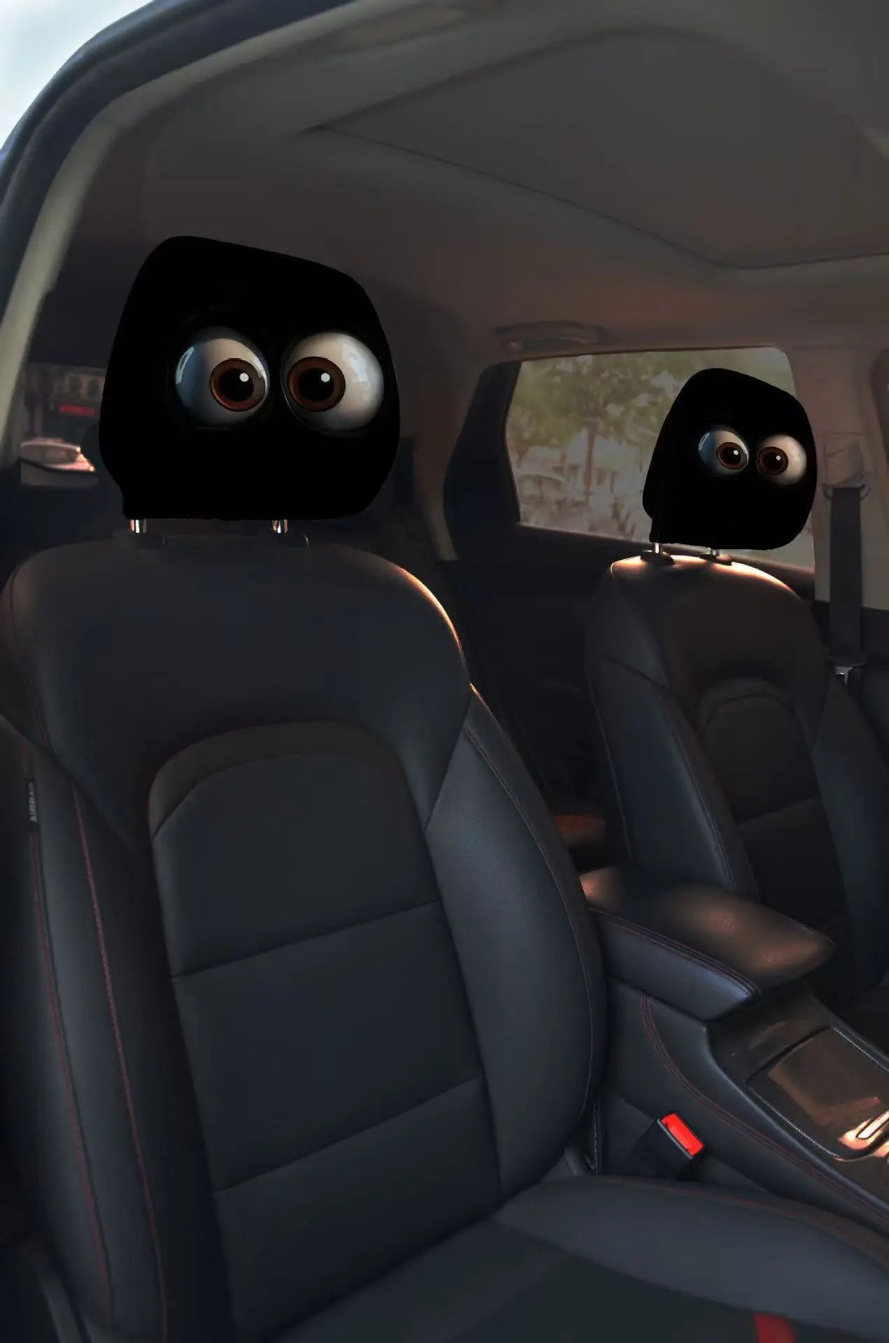 Car interior with animated eyes on the headrests