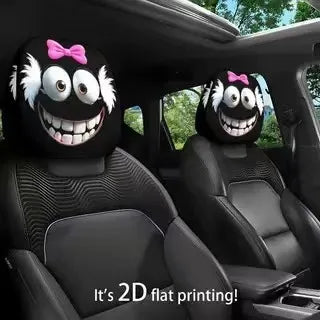 Car headrest covers with cartoon faces in a vehicle interior