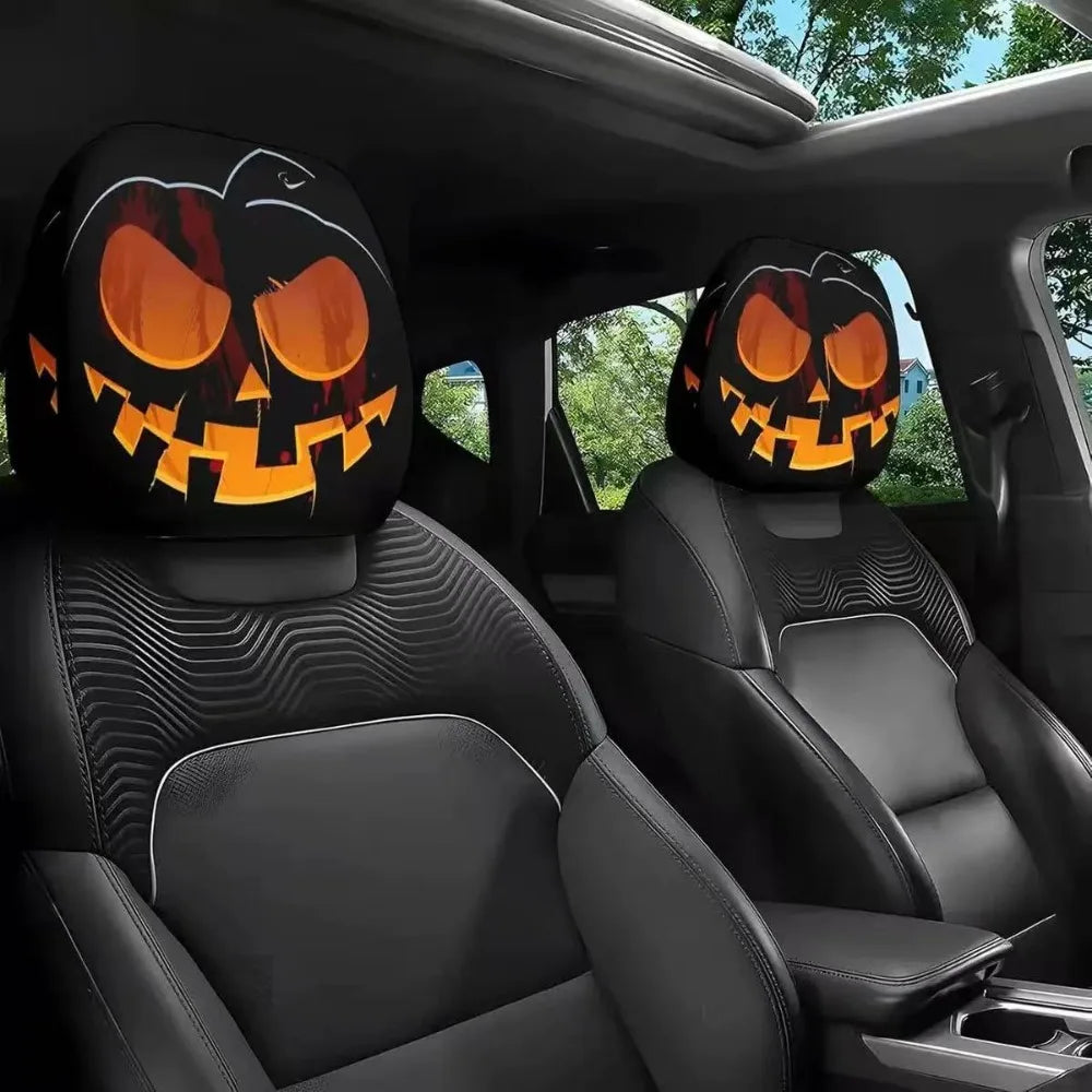 Car interior with Halloween-themed pumpkin headrest covers.